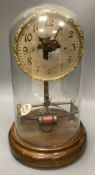 A Bulle 'skeleton' electric mantel clock, under a glass dome, height 38cm