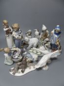 Seventeen Lladro figures of animals, or children holding animals