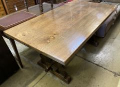 An 18th century style rectangular oak refectory dining table with vase shaped trestle ends, length