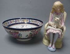 A French coloured biscuit porcelain figure of a seated girl and a Samson 'armorial' bowl, c.1900,