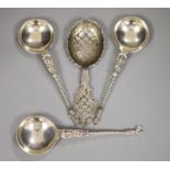 A late Victorian ornate pierced silver sifter spoon, Sheffield, 1898, 17.1cm and three continental