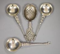 A late Victorian ornate pierced silver sifter spoon, Sheffield, 1898, 17.1cm and three continental