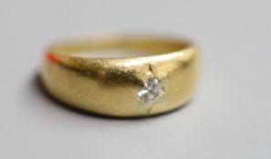 An early 20th century 18ct gold and gypsy set solitaire diamond ring, size J, gross 4.4 grams.