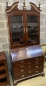 A George III parcel gilt mahogany bureau bookcase, (altered) length 100cm, depth 58cm, height 238cm