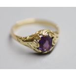 A yellow metal and purple sapphire set ring, with GCS report dated 8/3/2021, stating the cushion cut