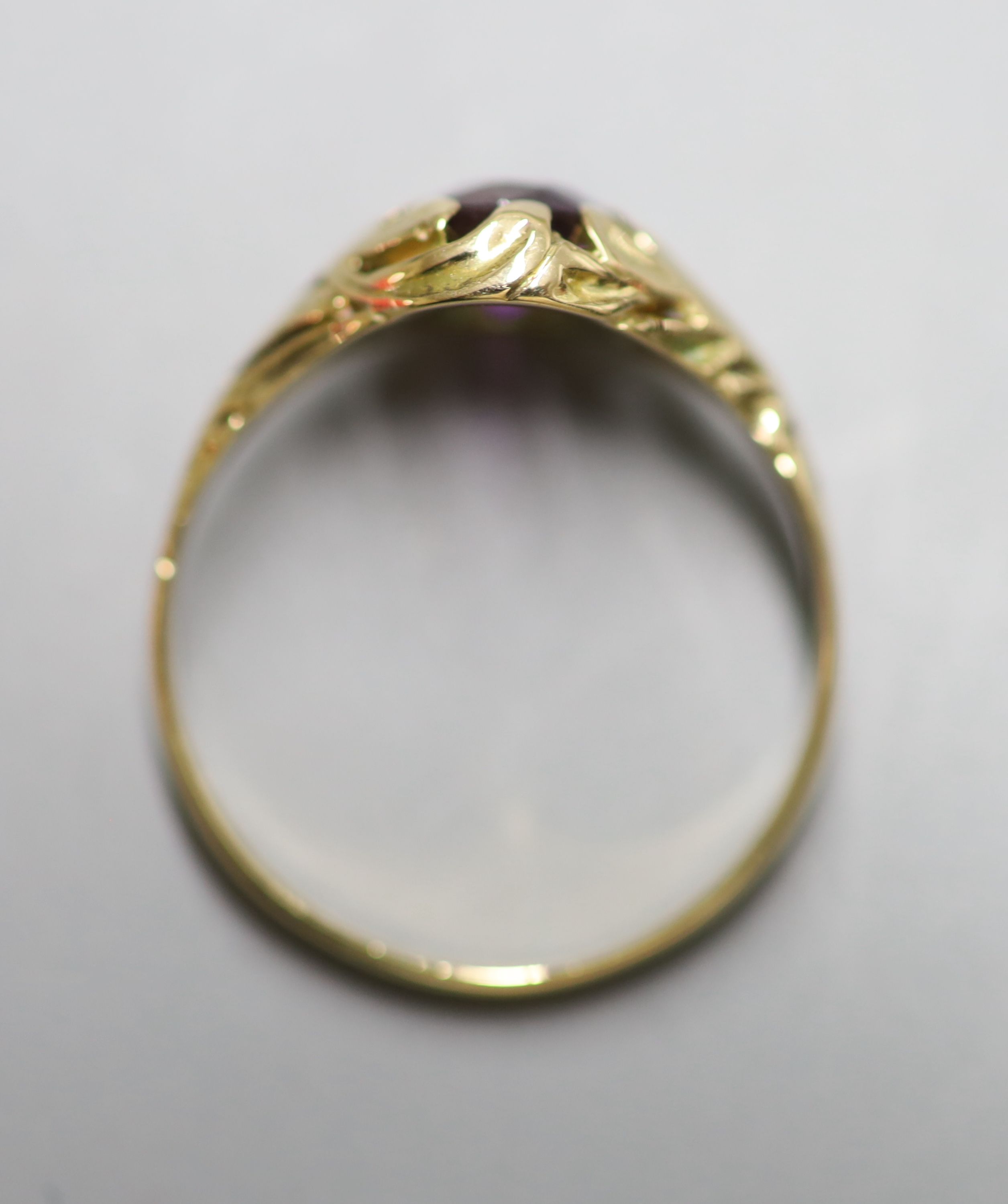 A yellow metal and purple sapphire set ring, with GCS report dated 8/3/2021, stating the cushion cut - Image 3 of 4