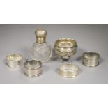 An Edwardian silver and glass globular scent bottle, a Continental cauldron shaped salt and four