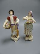 A pair of Rudolf Kammer porcelain figures of flower carriers, height 23cm