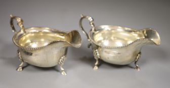 A pair of George V silver sauceboats, Goldsmiths & Silversmiths Co Ltd, London, 1910, height 8cm,