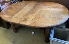 A 17th century style oak dining table, length 268cm extended (two spare leaves), width 122cm, height