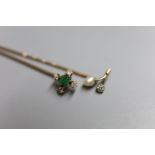 Two Edwardian yellow metal and gem set stick pins, emerald and diamond five stone, 64mm and