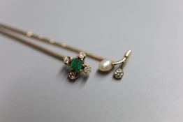 Two Edwardian yellow metal and gem set stick pins, emerald and diamond five stone, 64mm and