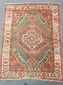 A North West Persian red ground rug, c.1900, 224 x 160cm