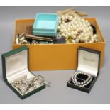 A quantity of assorted costume jewellery including necklaces and paste set brooches etc.