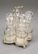 A small Edwardian silver cruet stand, with four glass cruets, Goldsmiths & Silversmiths Co Ltd,