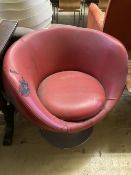A 1970's red leatherette tub framed swivel chair, width 74cm, depth 64cm, height 74cm