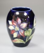 A Moorcroft vase, height 11cmCONDITION: Structurally good; one horizontal, curved scratch against