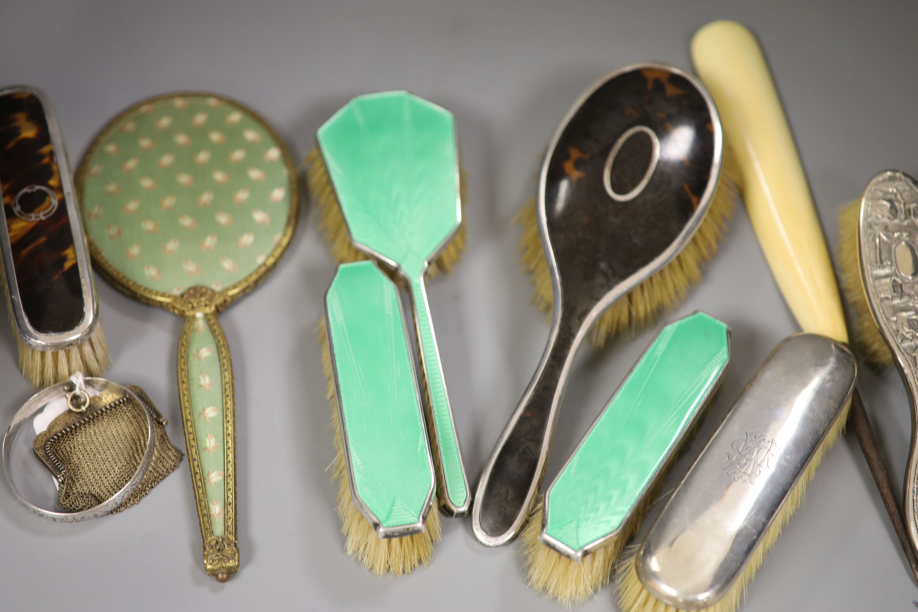 A guilloche enamel and silver-mounted three-piece brush and comb set, three other silver-mounted - Image 4 of 4