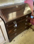 A George III mahogany bureau, the fall enclosing drawers, pigeon holes and secret compartments