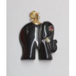 A 14k mounted black onyx? elephant pendant(chipped), with gem set eye, 19mm, gross 2.8 grams.