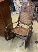 An early 20th century Thonet style caned bentwood rocking chair