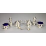 A George V silver six piece condiment set, with blue glass liners, Adie Brothers, Birmingham, 1927/