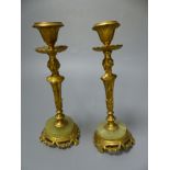 A pair of 19th century gilt metal and onyx figural candlesticks, height 17cm (a.f.)