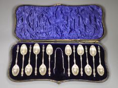 A late Victorian cased set of twelve silver apostle teaspoons and tongs, William Hutton & Sons,