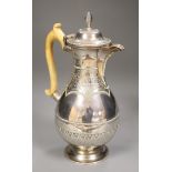 A Victorian silver baluster hot water pot, Henry Holland, London, 1878, with ivory handle, height