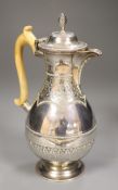 A Victorian silver baluster hot water pot, Henry Holland, London, 1878, with ivory handle, height