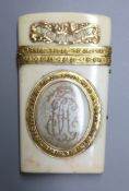 A 19th century French yellow metal(tests as 18ct) mounted ivory etui, inscribed 'Amitie' & '