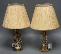 A pair of gilt metal and lustre drop lamps and silk shades