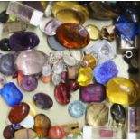 A quantity of mainly assorted loose cut and cabochon gemstones including amethyst, citrine, opal,