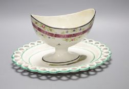 A 19th century creamware sugar bowl and a similar Wilson oval stand, longest 26cmCONDITION: Pedestal