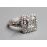 A modern 18ct white gold, princess, baguette and round cut diamond set square cluster ring, with
