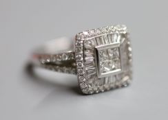 A modern 18ct white gold, princess, baguette and round cut diamond set square cluster ring, with