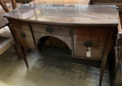 A Georgian mahogany bow front sideboard, fitted with oval brass drop handles, on square tapering