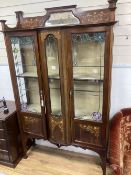 An Edwardian Art Nouveau marquetry inlaid mahogany display cabinet, with stained glass panelling,