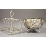 A George VI silver toastrack, Sheffield 1938, length 11.5cm and an Indian cusped white metal sugar