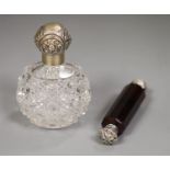 An Edwardian silver mounted glass toilet jar, 10.3cm and a white metal mounted ruby glass double