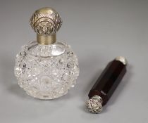 An Edwardian silver mounted glass toilet jar, 10.3cm and a white metal mounted ruby glass double