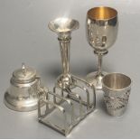 A Chinese white metal tot with applied dragon, 5cm, a 1920's small silver toastrack, a silver
