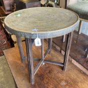 A Benares circular brass tray top occasional table, diameter 59cm, height 58cm Diam.60cmCONDITION: