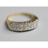 A modern 18ct gold and two row eighteen stone diamond set half eternity ring, size P/Q, gross 5.4