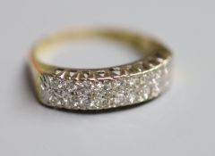 A modern 18ct gold and two row eighteen stone diamond set half eternity ring, size P/Q, gross 5.4