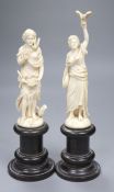 A pair of mid / late 19th century Dieppe carved ivory figures, in the form of classical maidens in