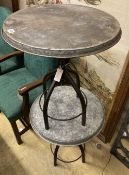 A pair of industrial style circular metal and wrought iron occasional tables, 54cm diameter,