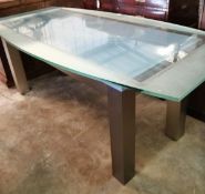 A glass top table, length 200cm, depth 100cm, height 76cm