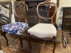 A set of six Victorian balloon back rosewood dining chairs