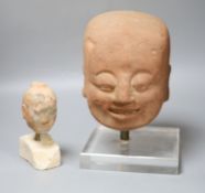 Two Chinese terracotta heads, tallest overall 30cm